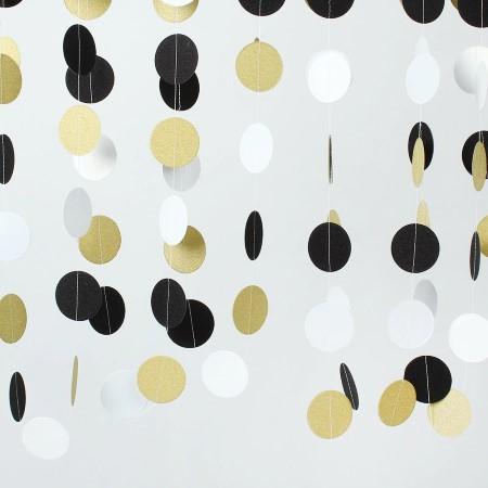 Bunting with Black, White and Gold Circles hanging as a backdrop I My Dream Party Shop I UK